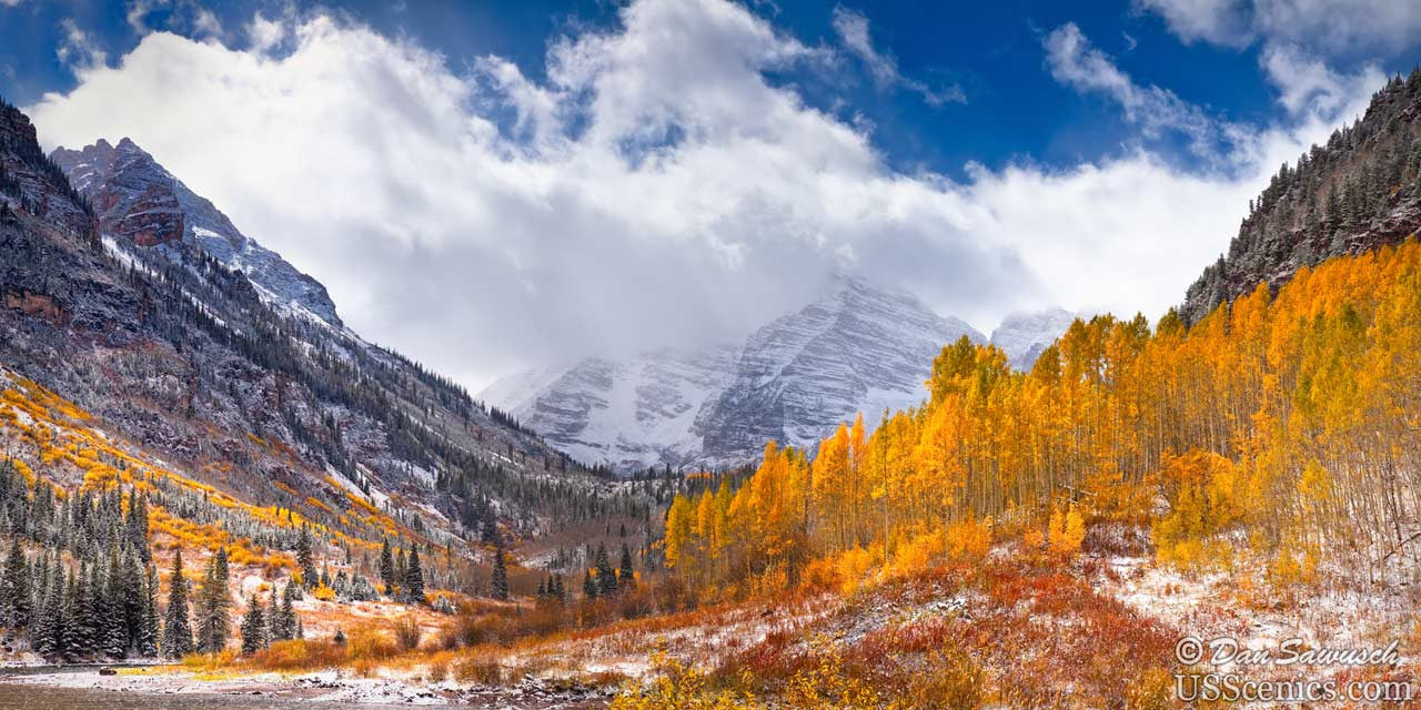 Snow capped maroon bells with yellow aspen trees